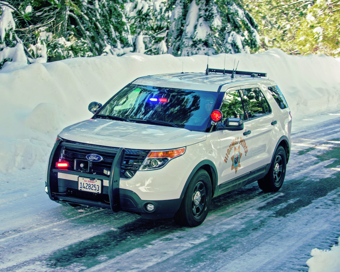 CHP White SUV in snow with lights_photo by Joe McHugh